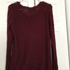 Woman’s red sweater